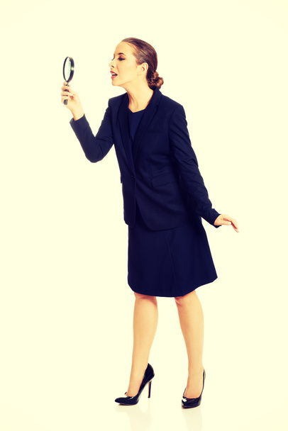Businesswoman with magnifying glass. - Fotografie, Obrázek