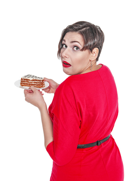Beautiful plus size woman eating cake isolated  - Фото, зображення