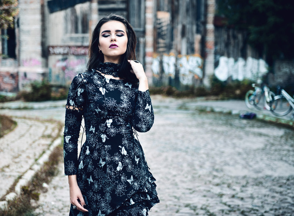 Gothic girl walking in town - Photo, image