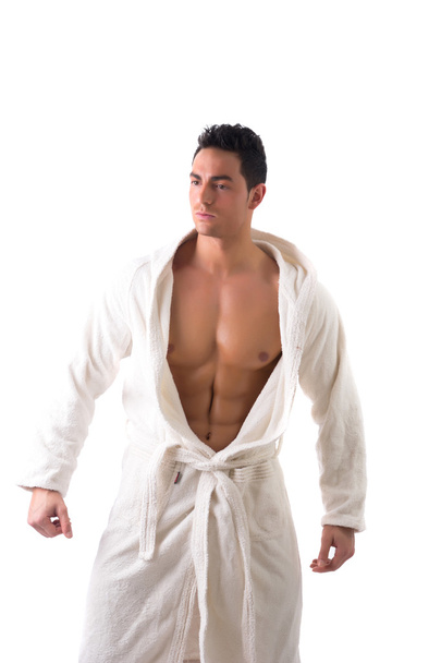 Handsome muscular young man wearing white bathrobe - Fotoğraf, Görsel