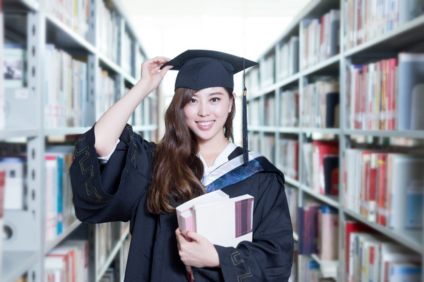 азіатська студентка тримає книги
 - Фото, зображення