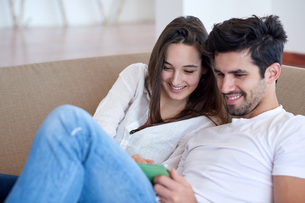 couple at modern home using tablet computer - Foto, Bild