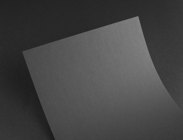 Blank flyer poster on grey to replace your design. - Zdjęcie, obraz