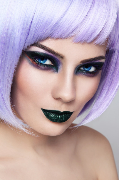 woman with fancy make-up and violet wig - Photo, image