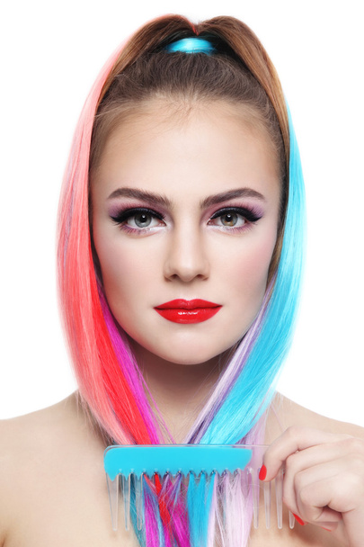 girl with colorful ponytail and comb - Photo, Image