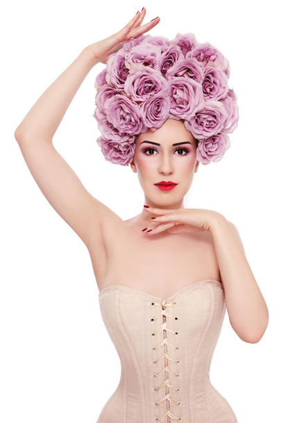 woman in corset with fancy wig of roses - Фото, зображення