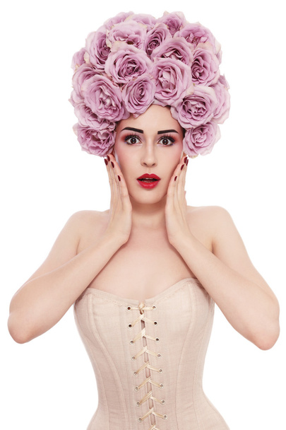 woman in corset with fancy wig of roses - Foto, Imagen