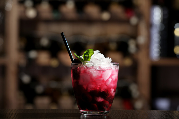 Glass of cocktail on bar background - Zdjęcie, obraz