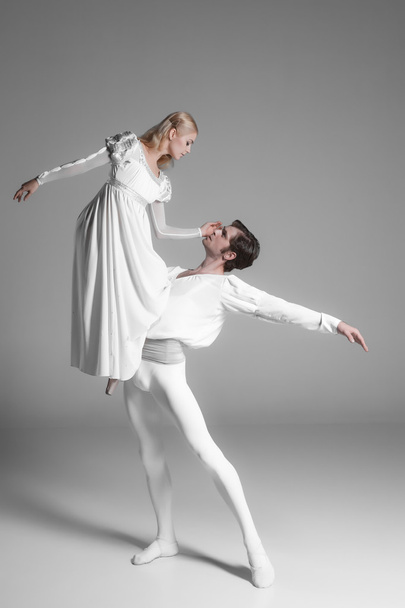 Two young ballet dancers practicing. attractive dancing performers  in white  - Foto, Imagen