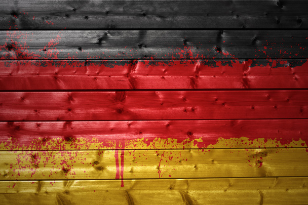 geschilderde Duitse vlag op een houten textuur - Foto, afbeelding