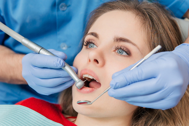 Woman having teeth examined at the dentist - Zdjęcie, obraz
