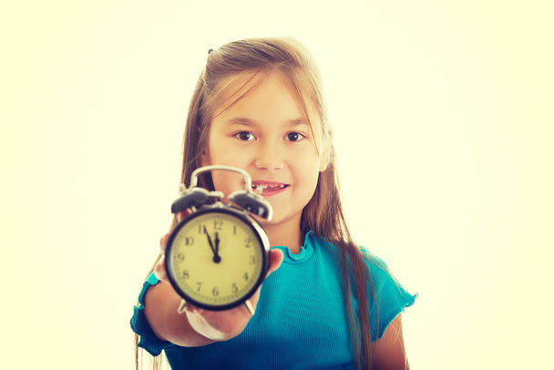 Girl holding the clock - Фото, изображение