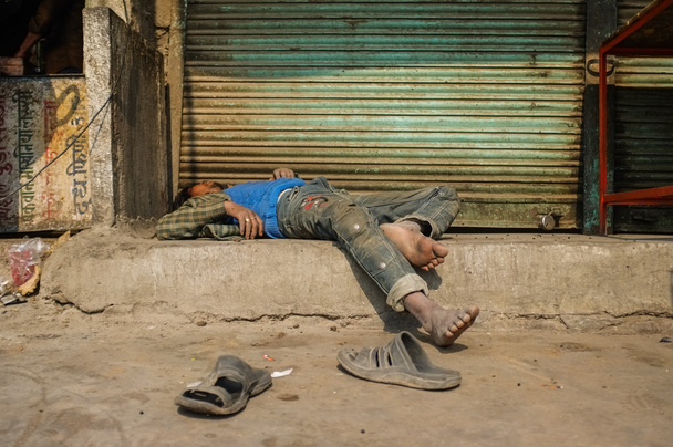 Drunk Indian man passed out - 写真・画像