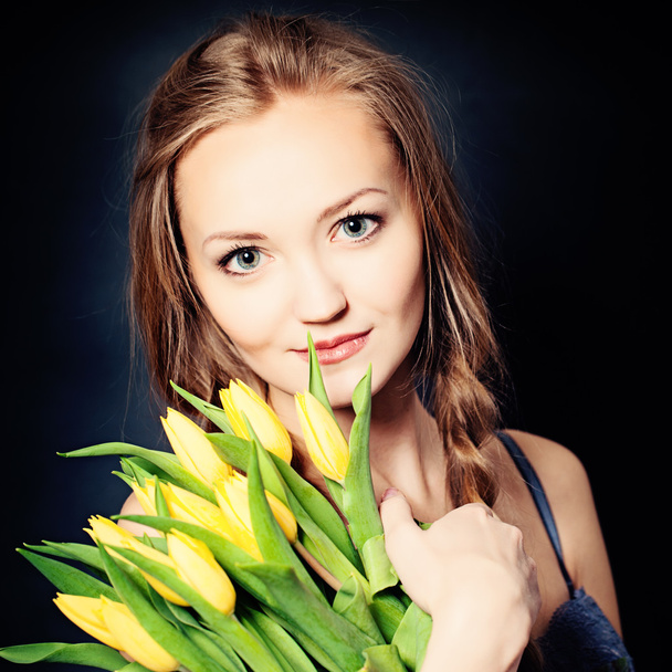 Cute Woman with Yellow Spring Flowers - Photo, Image
