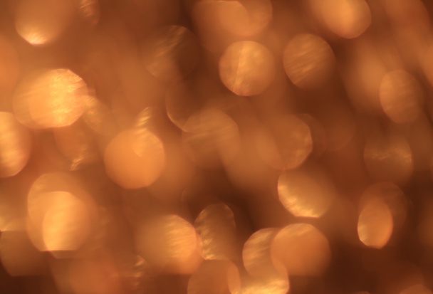 Festive gold background with bokeh effect - Fotó, kép