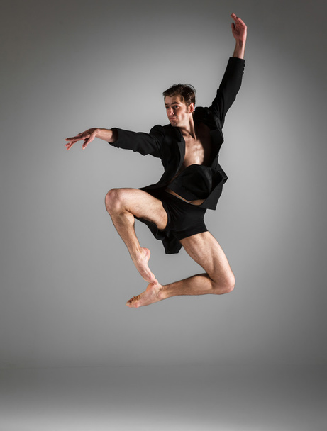 The young attractive modern ballet dancer jumping on white background - Zdjęcie, obraz
