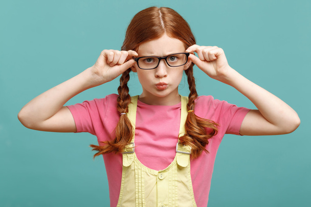 Little girl touching her glasses - Zdjęcie, obraz