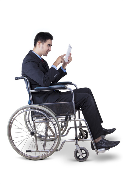 Disabled entrepreneur using digital tablet - Foto, Imagen
