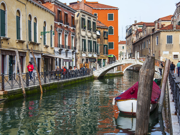 VENICE, ITALY - on MAY 1, 2015. Typical city landscape. Street canal and architectural complex of old buildings ashore - Photo, image