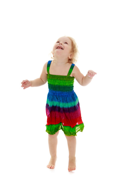 Very little cheerful girl jumping - Fotó, kép