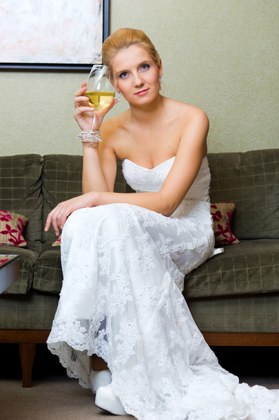 The bride with a glass of wine - Zdjęcie, obraz