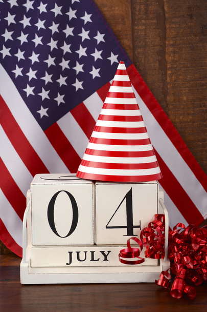 Fourth of July vintage wood calendar with flag background.  - Photo, Image
