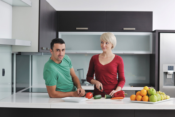 Young couple have fun in modern kitchen - Fotó, kép