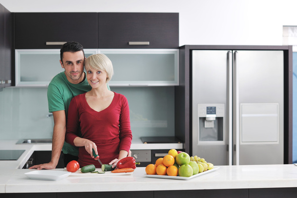 Young couple have fun in modern kitchen - Photo, Image