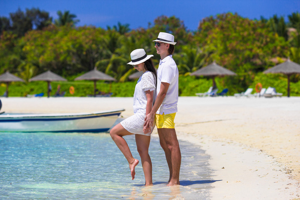 Young happy couple on white beach at summer vacation - Photo, Image