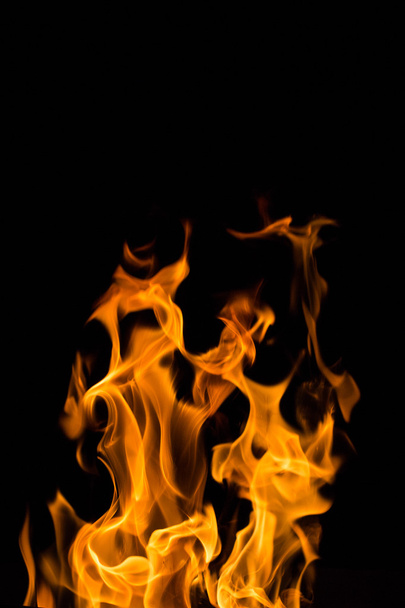 Real fire flames isolated on black - Fotoğraf, Görsel
