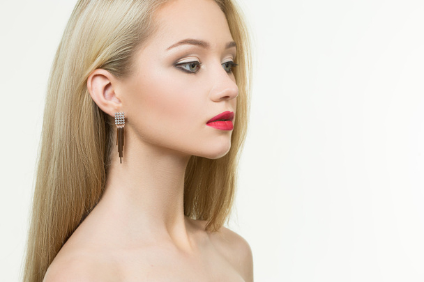 beautiful girl with red lips and earrings. fashion photo - Foto, immagini