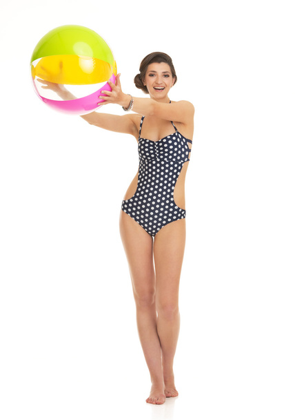 Full length portrait of happy young woman in swimsuit with beach - Foto, afbeelding