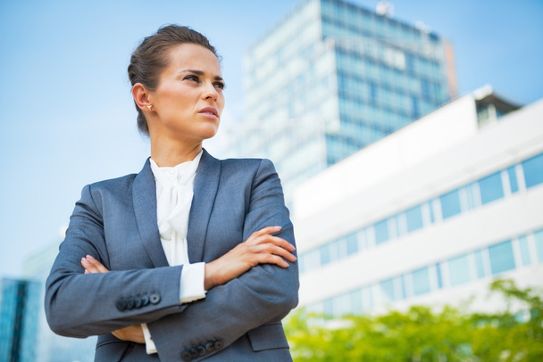 Portrait of confident business woman in front of office building - Fotoğraf, Görsel