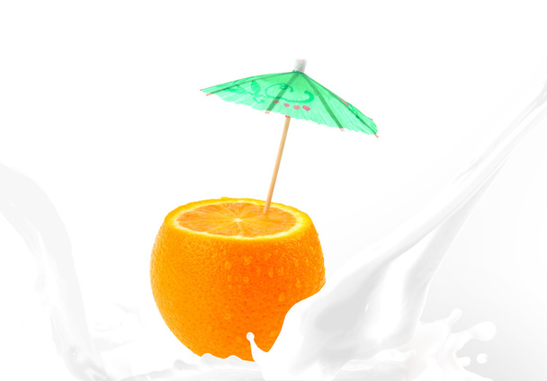 Splashing milk with orange - Photo, Image
