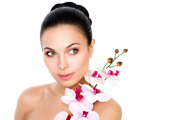 Beauty portrait of a girl with orchid schastilivoy. Skin care. L - Photo, Image