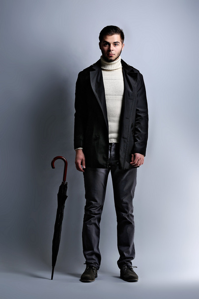 Elegant man with umbrella - Zdjęcie, obraz