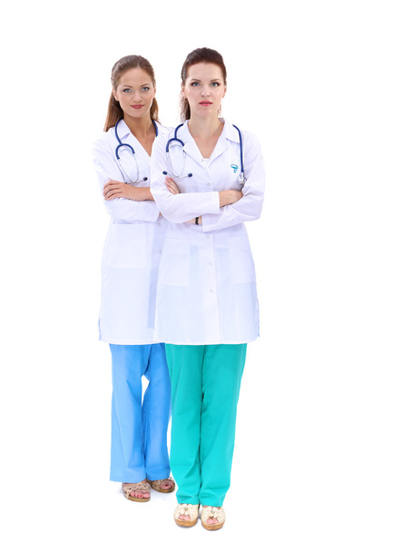 Two woman nurse watching X Ray image, standing in hospital - Valokuva, kuva