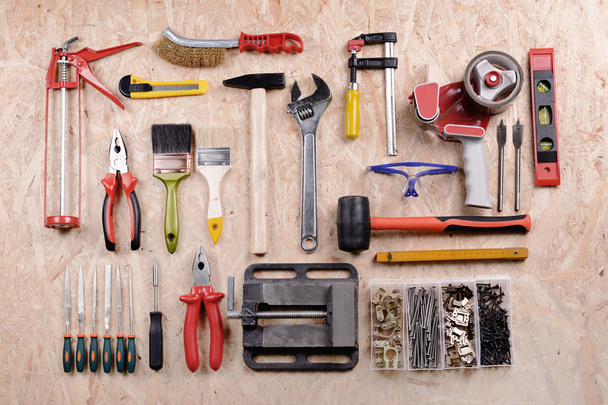 Set of tools on plywood, top view - Фото, изображение