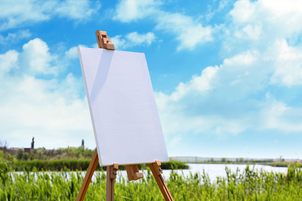 Easel with canvas outdoors - Photo, Image