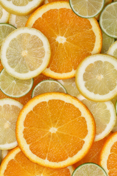 Collection of sliced orange, lemon and limes background - Фото, зображення