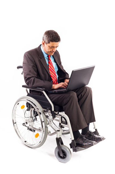Man in a wheelchair with laptop - Fotoğraf, Görsel