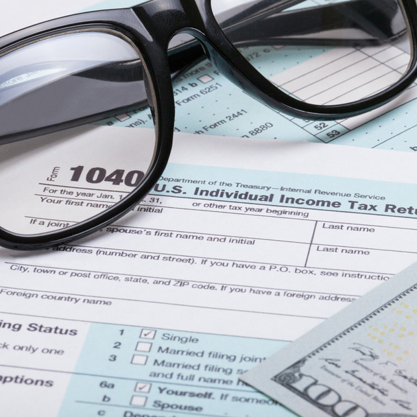 US 1040 Tax Form, glasses and dollars - close up shot - Photo, Image