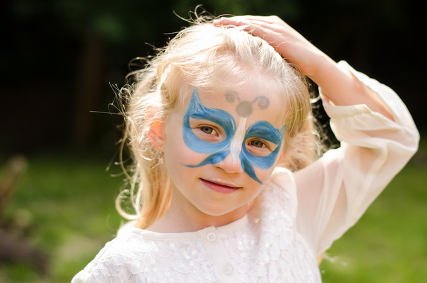 blond girl with face-painting - Foto, immagini
