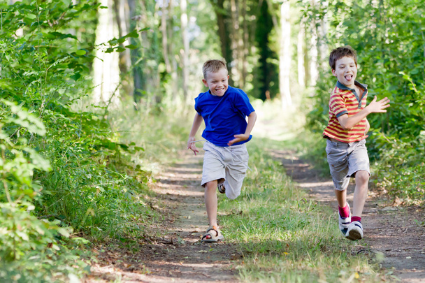Young children running in nature - Valokuva, kuva