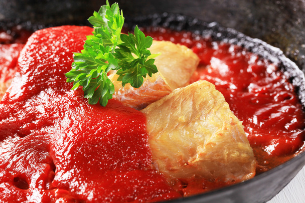Pan fried fish fillets with tomato sauce - Fotoğraf, Görsel