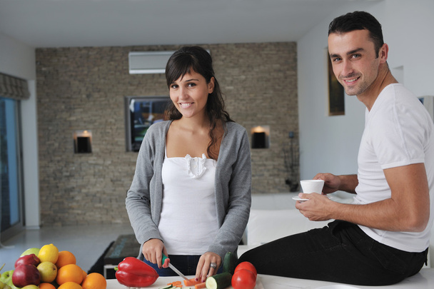Young couple have fun in modern kitchen - Fotoğraf, Görsel