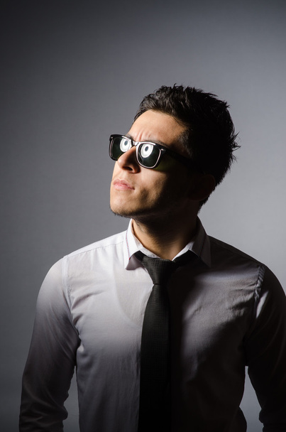 Young man in cool sunglasses isolated on gray - Photo, image