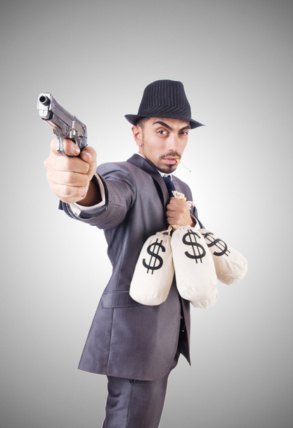 Homme d'affaires criminel avec des sacs d'argent
 - Photo, image