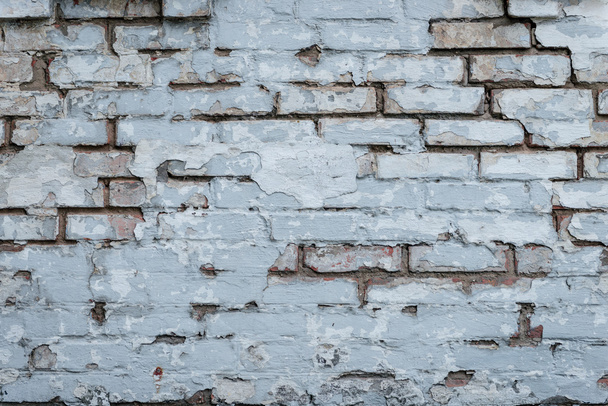 The brick texture with cracks and scratches can be used as a background - Photo, Image