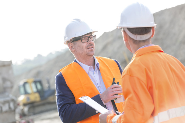 Architects discussing at construction site - Zdjęcie, obraz